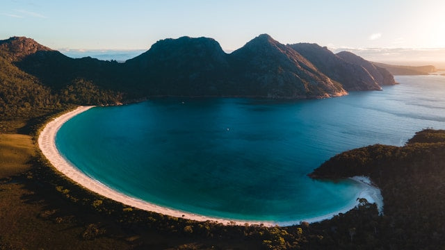 beach in Tasmania surrounded by mountains